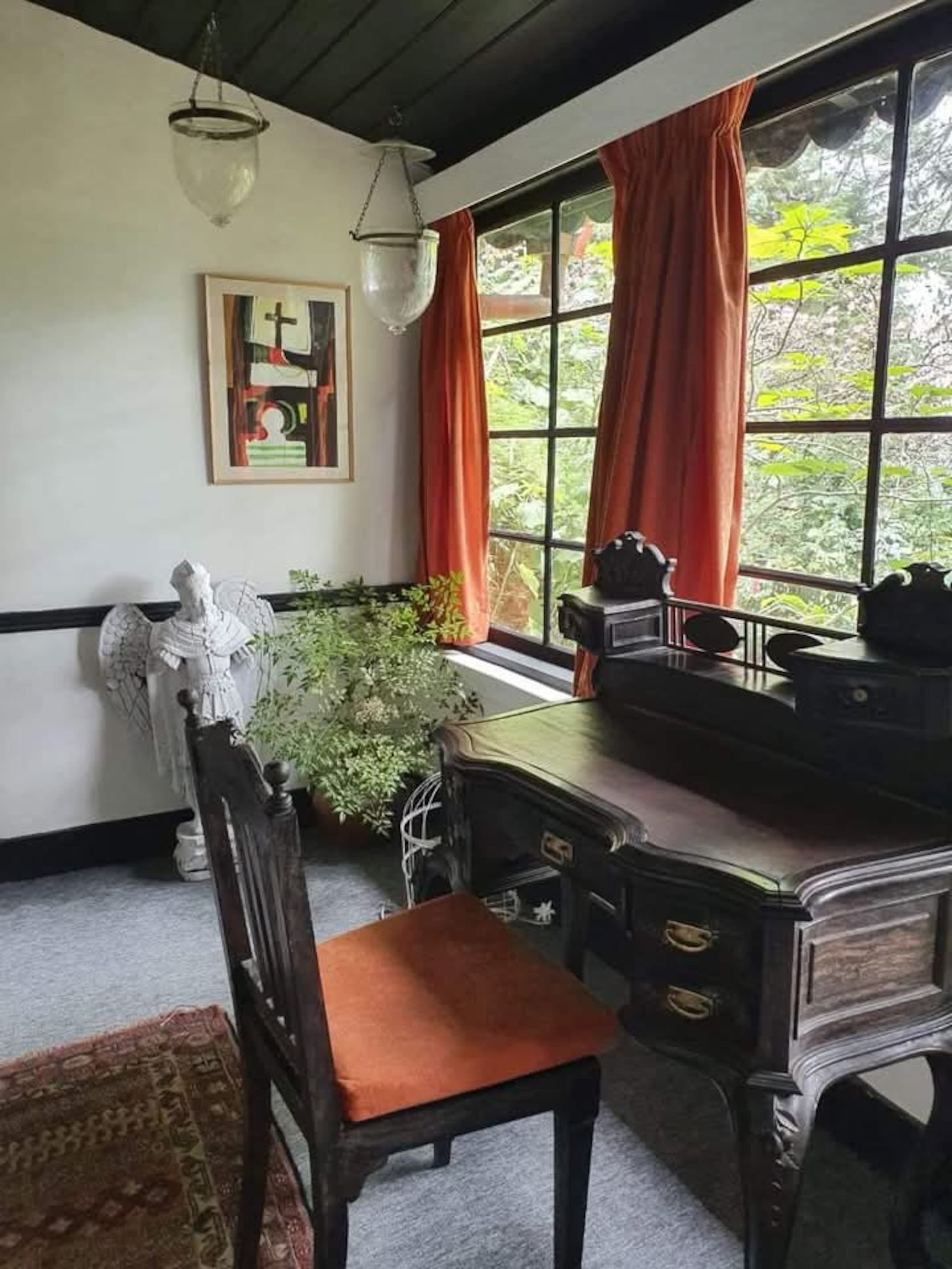 A writing desk beneath the veranda’s windows